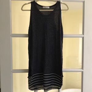 Heather charcoal grey razor back top with black and white stripes at the bottom.